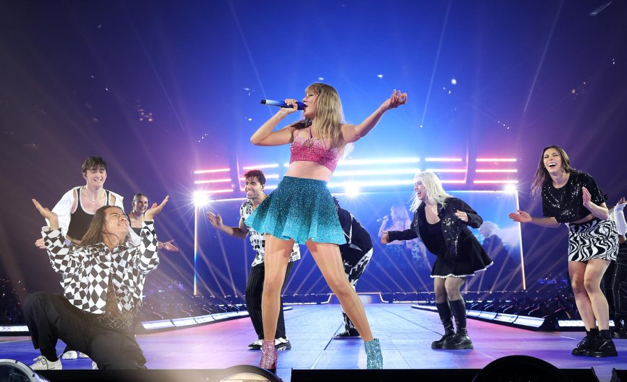 <p>For her Paris 1989 set, Swift opted for a pink crop top and a teal miniskirt. She also wore a pair of mismatched booties in each color.</p>