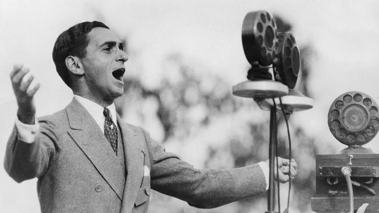 Irving Berlin is shown singing at the dedication of Los Angeles City Hall. Berlin wrote scores for many successful films, including "Top Hat," "Easter Parade" and "Holiday Inn." Getty Images