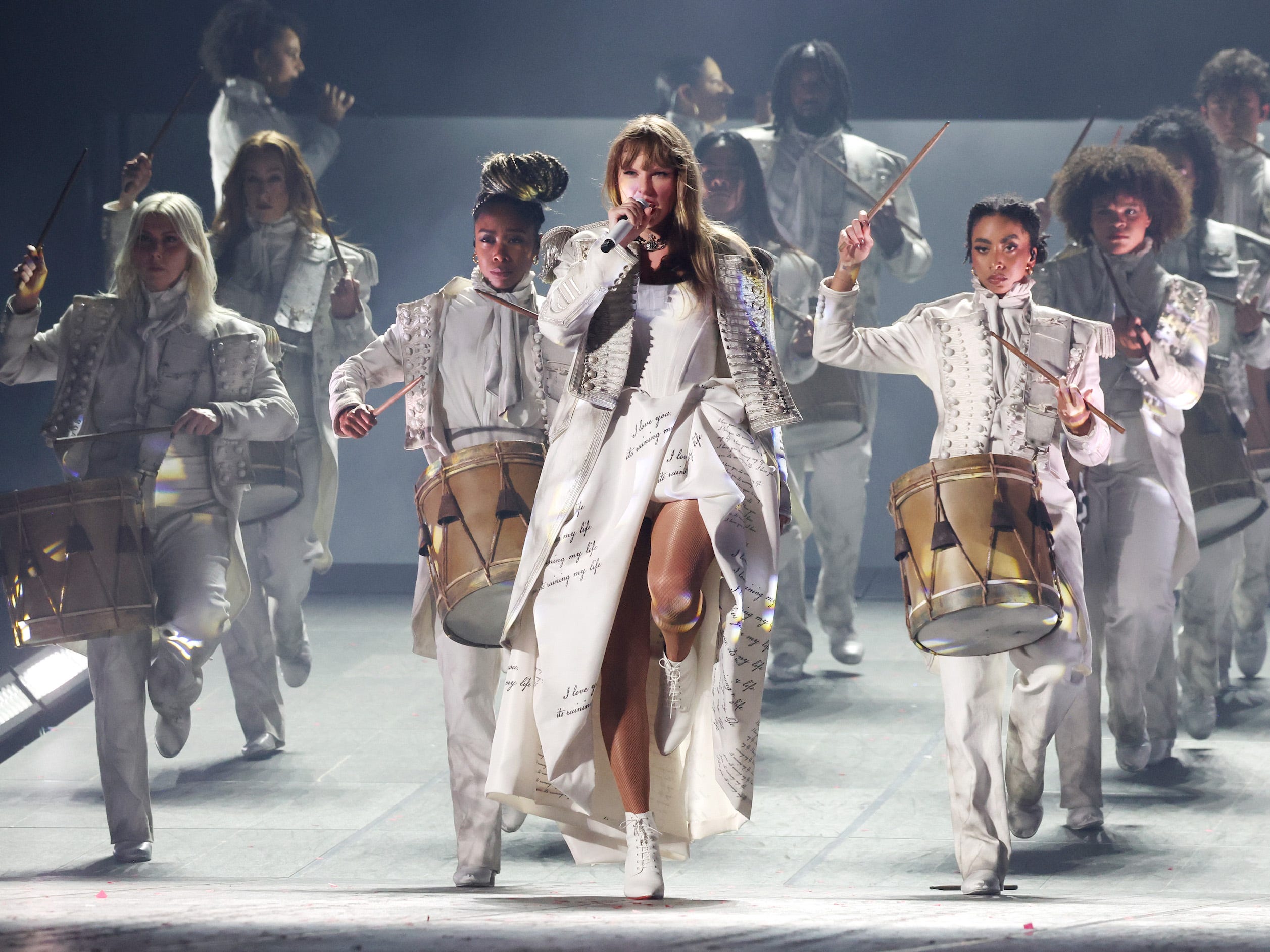 <p>Swift adds a military jacket atop her "Tortured Poets" gown to sing "The Smallest Man Who Ever Lived," an impassioned performance that casts Swift as the drum major in a marching band. The look is still a little corny, but at least it's a full embrace of the theatrical costume vibe.</p>