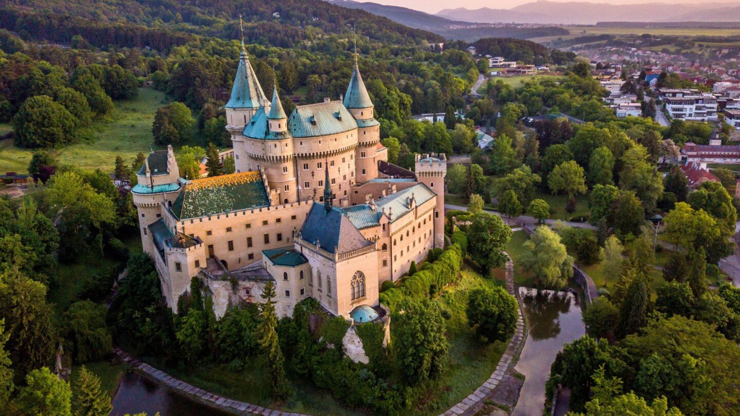 <p>This fairytale medieval castle in Slovakia looks like it’s been lifted straight from a storybook. Built in the 12th century, Bojnice Castle, also known as the ‘Castle of Spirits,’ is surrounded by lush forests and a lake. The castle is as beautiful from the inside as it is from the outside. The castle offers a magical escape into years-old history and the romantic vibes it gives off. </p>