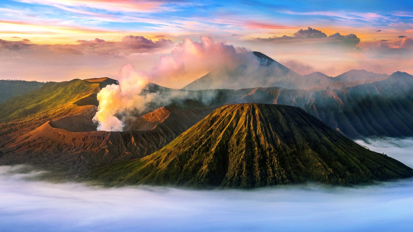 <p>Mount Bromo is part of the Tengger massif in East Java, an active volcano in a vast plain called the Sea of Sand. The natural spectacle of watching the sun rise over this crater, with clouds of smoke and ash drifting out, offers a magical moment that feels outwardly. Mount Bromo is renowned for its otherworldly landscapes, as shown in this picture.</p>
