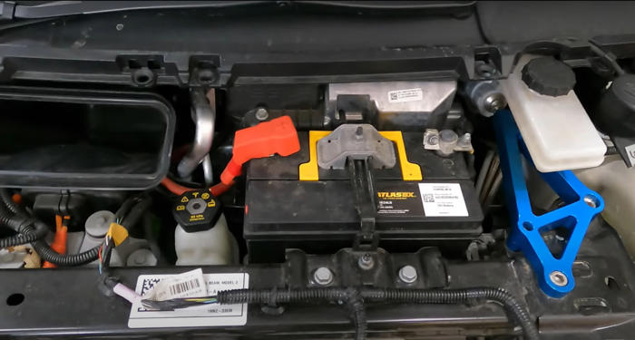 what is the purpose of the 12-volt battery in an ev?