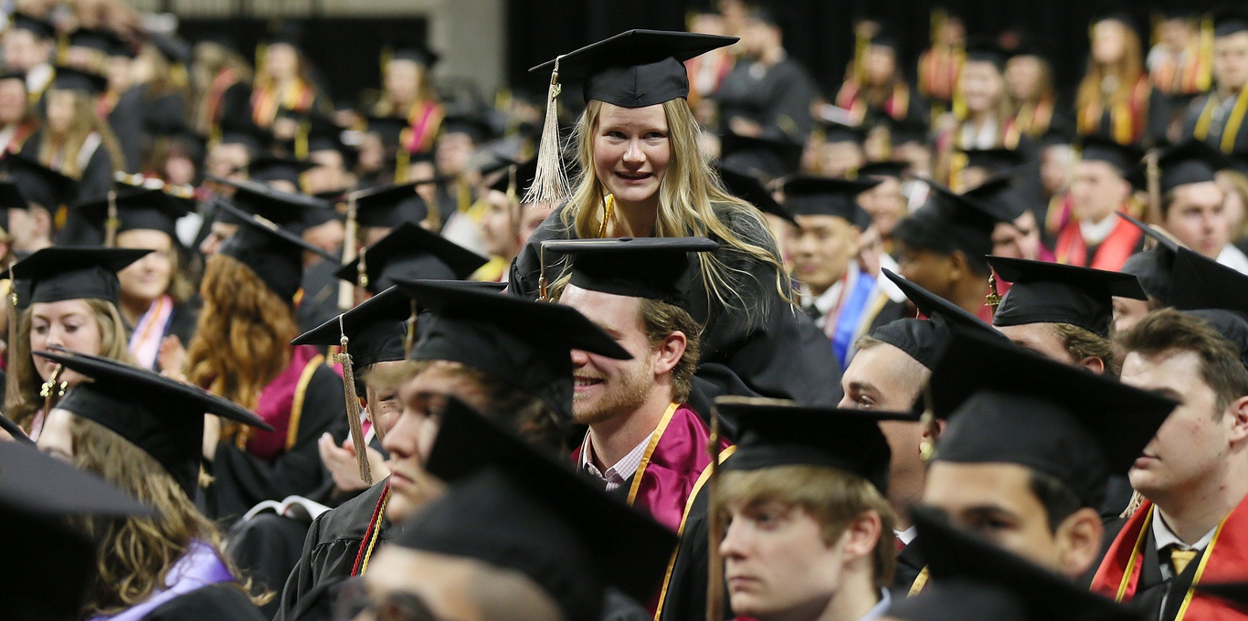 Cyclones tear across the stage at Iowa State University commencement