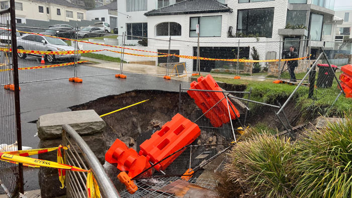 locals in sydney's east blast council after 10-metre sinkhole opens where landslip happened last year