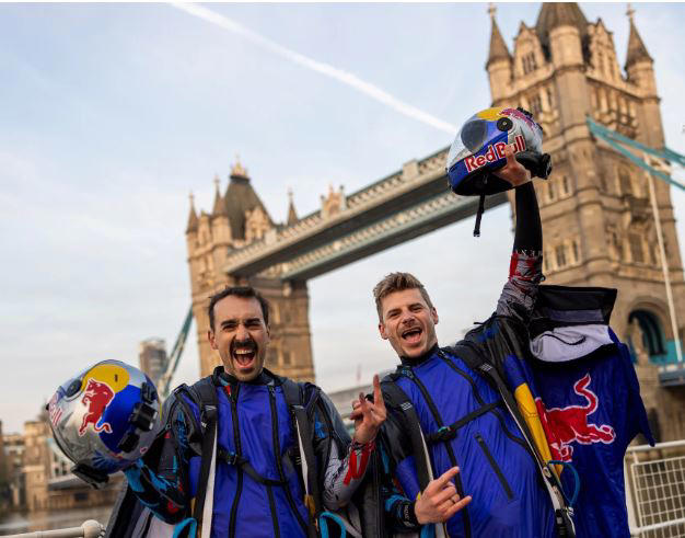 skydivers make history with incredible wingsuit flight through tower bridge