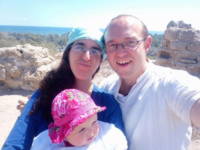 Zechariah Pesach Haber z"l, his wife, Talia, and their child, on Israel Independence Day, in 2019. (courtesy)