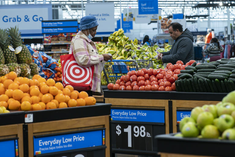 Customers buy vegetables inside the Walmart Supercenter in North Bergen, Thursday, Feb. 9, 2023, in New Jersey. (AP Photo/Eduardo Munoz Alvarez)