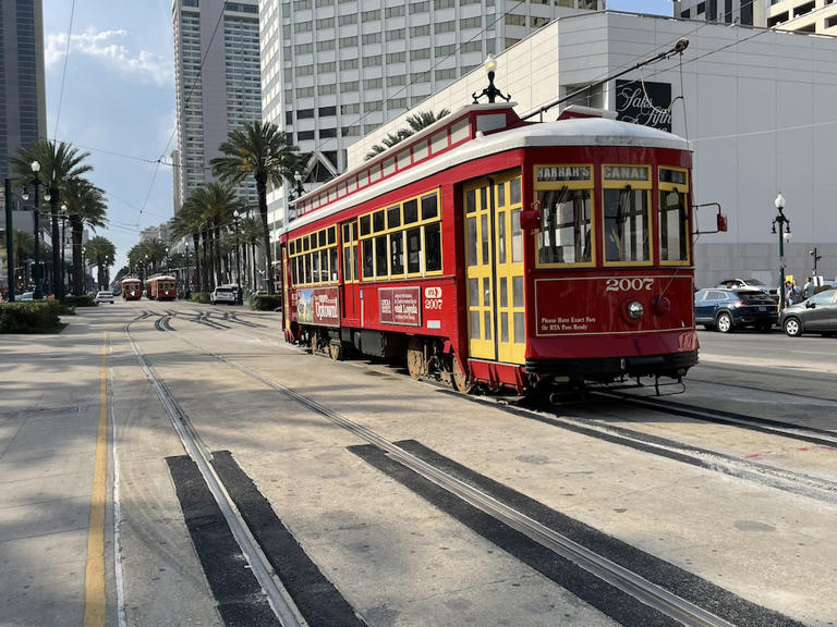 red trolley in downtown area