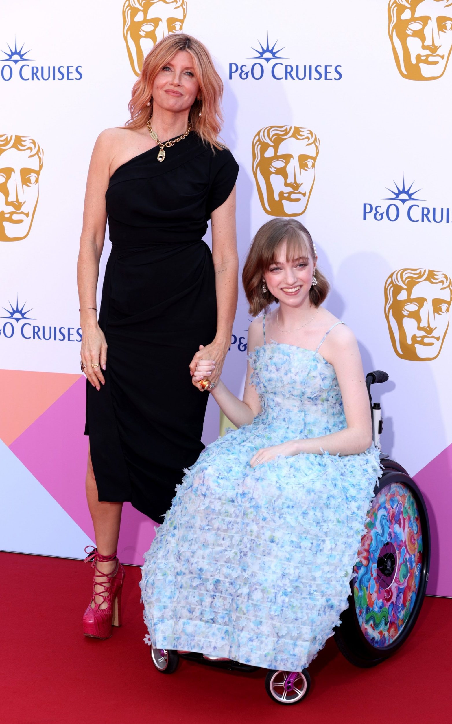 <p><p>Sharon Horgan took to the red carpet in a pair of towering pink Vivienne Westwood platforms and a one-shoulder LBD. She matched her shoes to her hair with a subtle pink rinse. </p><p>She was accompanied on the red carpet by her Best Interests co-star, Niamh Moriarty who wore a beautiful pale blue dress. </p></p>