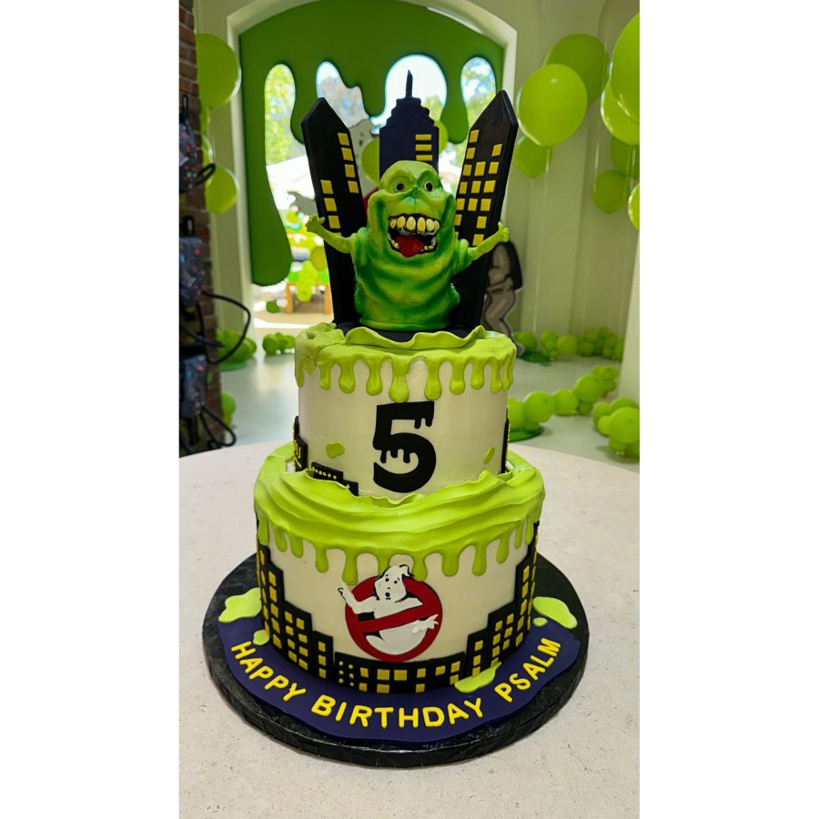 <p>The two-tiered cake was covered in dripping green neon icing, the iconic <em>Ghostbusters</em> logo and a green ghost that rose from the top layer in front of miniature skyscrapers. “Happy Birthday Psalm,” the dessert read.</p>