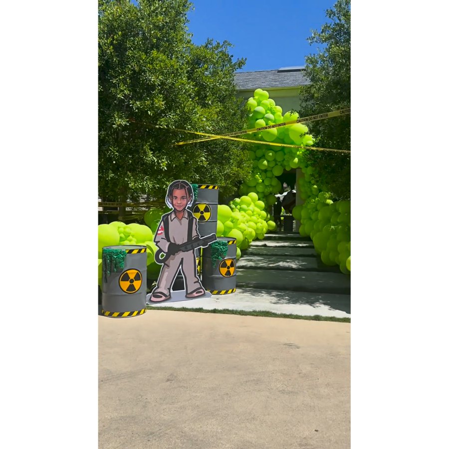 <p>When walking up to the gathering, guests were welcomed by a cut-out of Psalm in <em>Ghostbusters</em> gear. Kardashian’s front yard was covered with numerous green balloons, caution tape strung between trees and bins of hazardous waste.</p> <p>“OK, Psalm’s <em>Ghostbusters</em> party, how cute is this? It’s about to start. Look at how cute Psalm is,” Kardashian said while zooming in on the figure, to which Saint noted, “It doesn’t really look like him.”</p> <p>“Yes, it does, Saint. Come on,” Kardashian replied as she continued to walk, while Saint added, “It looked like me back then.”</p>