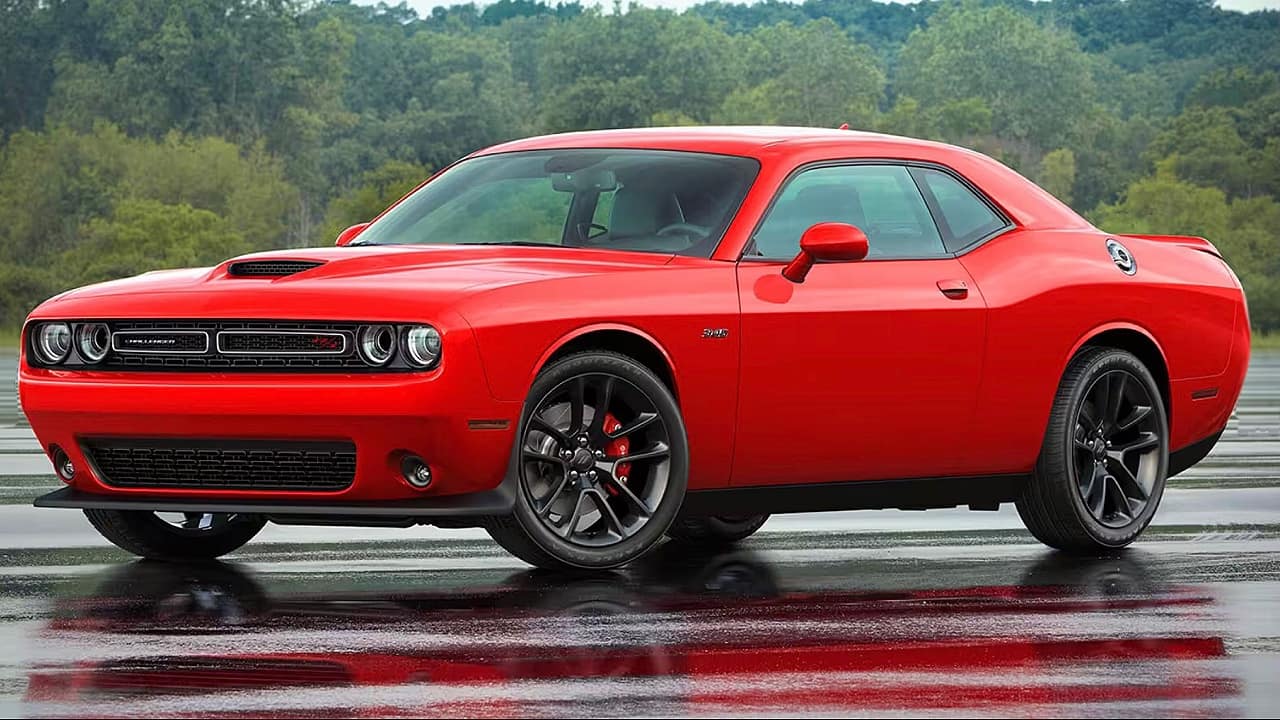 <p>The Dodge Challenger is the polar opposite of a car like the Porsche 911 GT3 RS. Instead of a high-revving, cutting-edge flat-six motor, it can be had with various muscular old-school V6 and V8 motors. The V6-powered SXT and GT are both available as new models for way over $40k, but we’d recommend you get a one-year-old R/T model that comes fitted with a 375-horsepower 5.7-liter V8. </p>