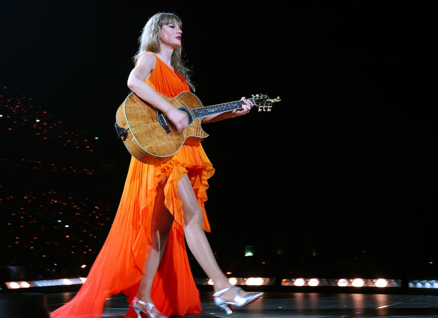 <p>Swift brought another orange look to the Paris shows, rocking a bright high-low dress for her May 11, 2024 concert.</p>