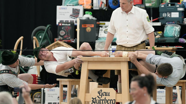 German men finger wrestle in intense, centuries-old competition: In photos
