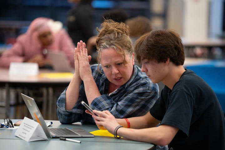 Rachel Hopper and her son Espen Hopper-Willams filled out the FAFSA form together on a laptop during the financial aid workshop at South High School in Minneapolis on Feb. 6.