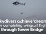 Skydivers soar through Tower Bridge on wingsuit flight after 3,000ft helicopter jump<br><br>
