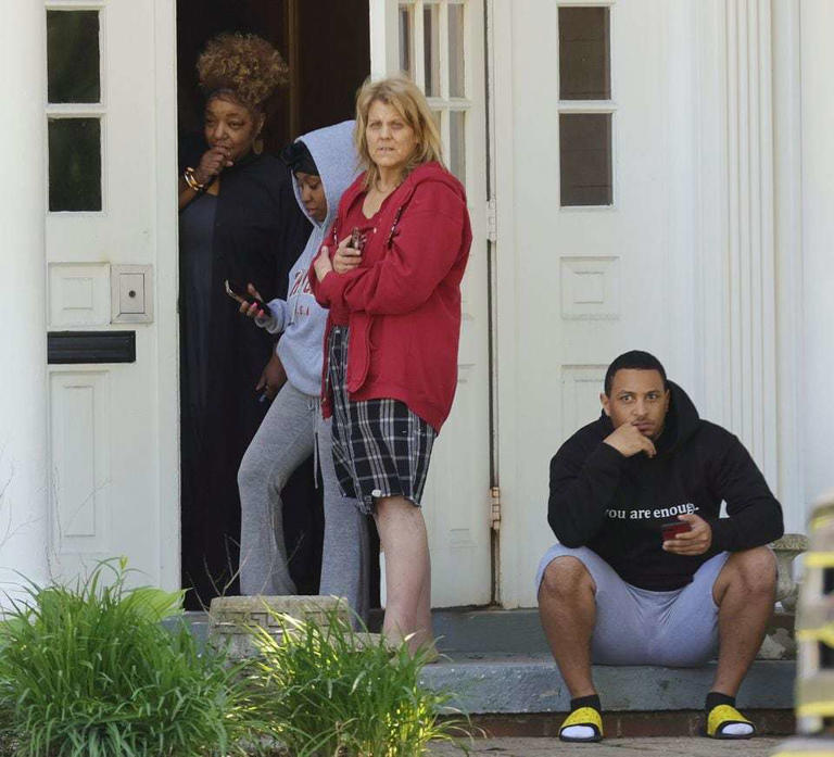 Shaker Heights residents watch the SWAT and police activity surrounding the Carlton House Condominiums off Van Aken Boulevard after shots were fired. The suspect was believed to be in one of the condo rooms.