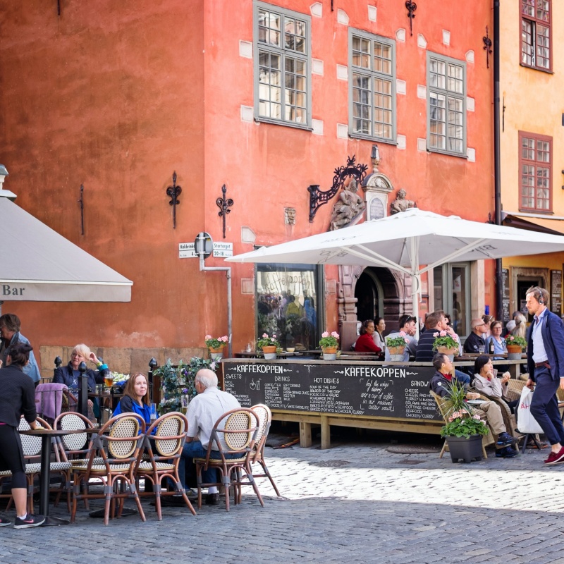 Busy sidewalk cafes in picturesque historic Gamla Stan, the oldest neighborhood in Stockholm