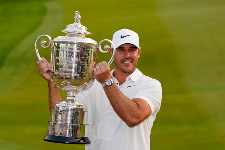 May 21, 2023; Rochester, New York, USA; Brooks Koepka poses with the Wanamaker Trophy after winning the PGA Championship golf tournament at Oak Hill Country Club. Mandatory Credit: Adam Cairns-USA TODAY Sports