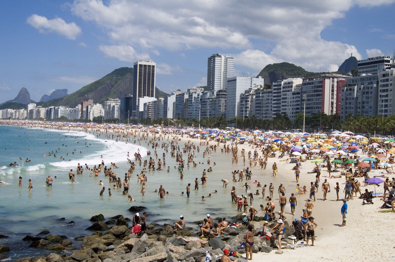 <p><b>Peak Season</b>: December to March</p><p>Stretching over 2.5 miles, Rio's legendary Copacabana Beach is a magnet for tourists, locals, and visitors alike. Every New Year's Eve, over <a href="https://www.whereinrio.com/en-gb/news-detail/discover-the-traditions-and-dream-destinations-for-a-new-years-eve-in-brazil/17076#:~:text=Every%20year%20more%20than%202,by%20a%20spectacular%20fireworks%20display.">2 million people</a> flock to the beach for its traditional fireworks and celebrations, where everyone dresses in white for good luck. But it's not just holidays — on any given day, you'll find people sunbathing, playing volleyball, or just hanging out.</p><p>During peak times, like summer or festivals, the beach becomes so packed that finding a spot to lay your towel can feel like a sport in itself. For a more relaxed visit where you can truly enjoy the beach and its surroundings, try coming in late spring or early autumn. </p>