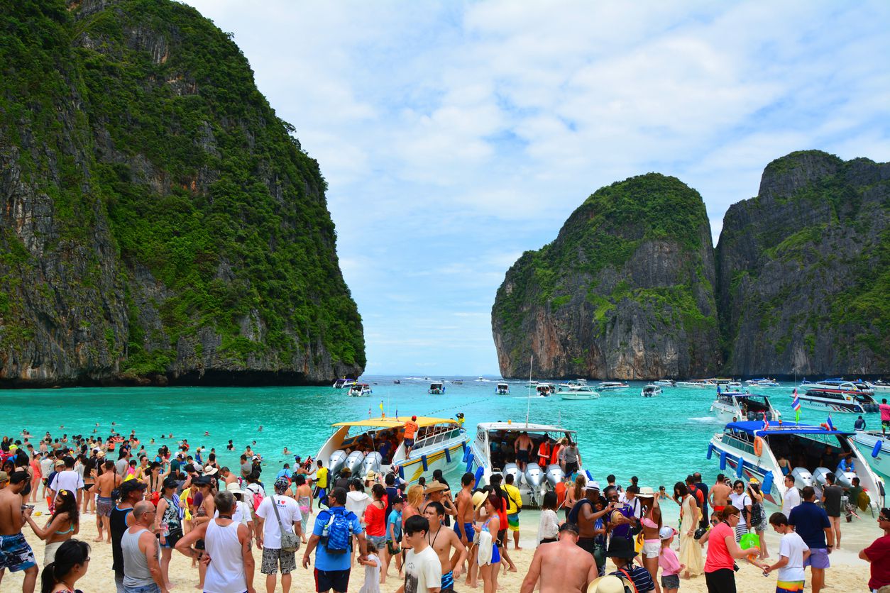 <p><b>Peak Season</b>: November to April</p><p>Maya Bay on Phi Phi Island, Thailand, became an icon after its starring role in Danny Boyle's 2000 "The Beach," a film that ironically centers around the quest to keep a perfect beach hidden from the mainstream. Yet, the movie's success turned Maya Bay into a magnet for daily throngs of up to 5,000 visitors, overwhelming the delicate ecosystem and leading to significant environmental strain. This forced Thai authorities to close the beach in <a href="https://www.theguardian.com/world/2018/oct/03/thailand-bay-made-famous-by-the-beach-closed-indefinitely">2018 to rehabilitate it</a>. </p><p>After reopening in 2022 with strict <a href="https://www.bbc.com/news/world-asia-59871943">new regulations to protect</a> its fragile ecosystems, including limiting the number of visitors and banning boats from docking within the bay, Maya Bay is once again welcoming tourists but in a more controlled manner. If you plan to experience its real beauty, visiting outside the high season might be wiser.</p>