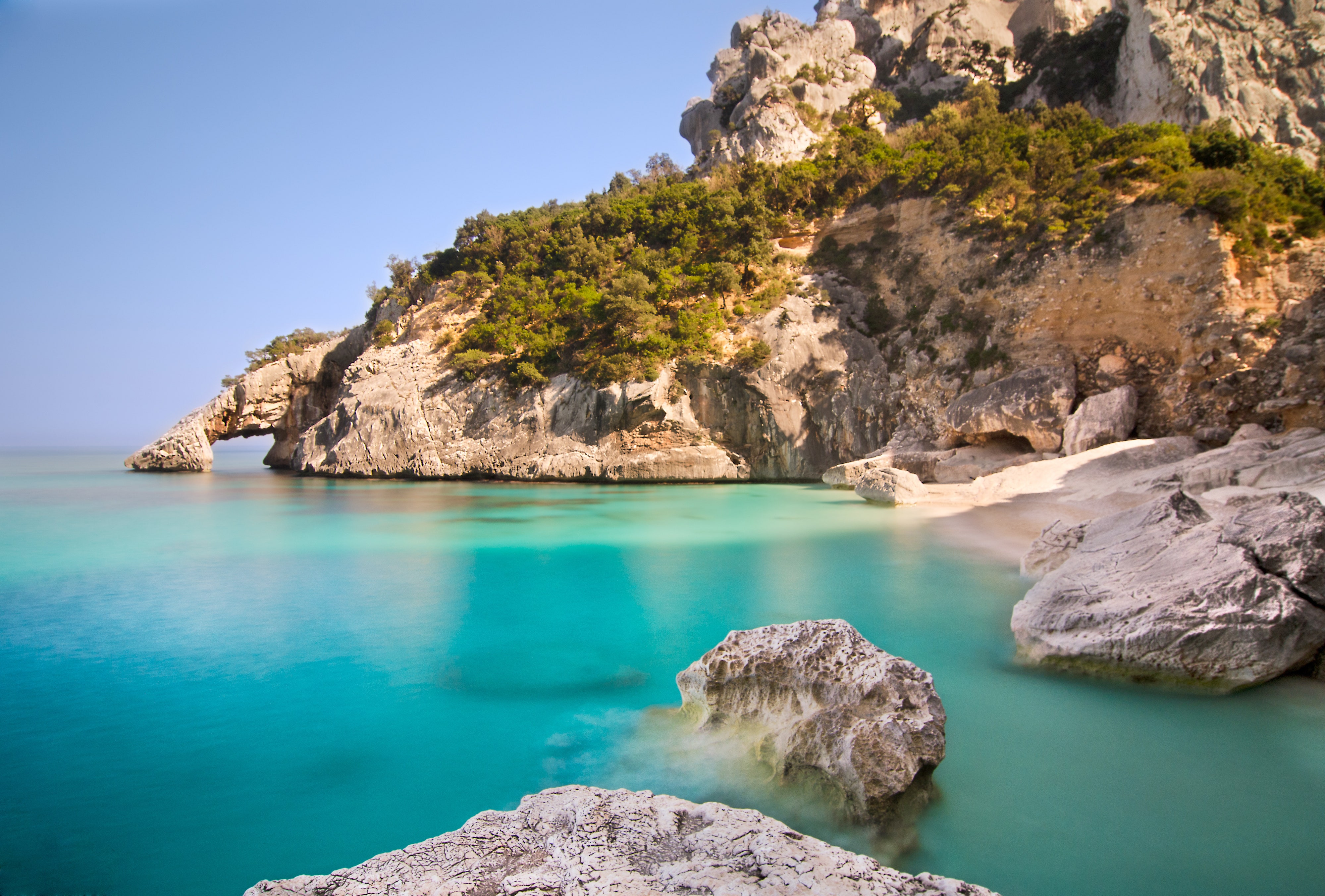 <p>Created by a landslide in 1962, Cala Goloritzé is located at the base of a ravine on <a href="https://www.cntraveler.com/story/exploring-inland-sardinia-italy?mbid=synd_msn_rss&utm_source=msn&utm_medium=syndication">Sardinia</a>’s eastern coast. It’s tiny, but no less beautiful with its limestone cliffs, soft ivory sand, and access to the striking blue-green waters of the Gulf of Orosei. In fact, it’s so special that it was anointed as a <a href="https://www.cntraveler.com/galleries/2014-12-23/most-beautiful-unesco-world-heritage-sites-galapagos-taj-mahal-yosemite?mbid=synd_msn_rss&utm_source=msn&utm_medium=syndication">UNESCO World Heritage Site</a> in 1995, and is best known for a two incredible rock formations: a towering spire and a natural stone arch.</p> <p>Cala Goloritzé is accessible via car-and-foot (be prepared for a short though rocky hike) from Santa Maria Navarrese, home to the lush <a href="https://cna.st/affiliate-link/9B6f5kDzu8NHk3BVDnrLhuGHzKJVxw59gs5zVA8C1vPxfhDS5zbtpuEWYRYboPATBWZx5pkjd4dxaxfQytgAoWb2rQ78gPj7mrmvdmtaPUtJEzL8CutcX6t94RWM5Efu4CEcEtj6HFGbUBcZB4X82NQoeyhxoUh4pjnheMvdDnGMFWB9kBRzMDjkMRDg4YtF8U" rel="sponsored">Lanthia Resort</a>, which has a private beach for lazier days. To get here, drive up from Cagliari, Sardinia’s capital, which you can reach via plane from Rome or Milan, or overnight ferry from Naples.</p><p>Sign up to receive the latest news, expert tips, and inspiration on all things travel</p><a href="https://www.cntraveler.com/newsletter/the-daily?sourceCode=msnsend">Inspire Me</a>