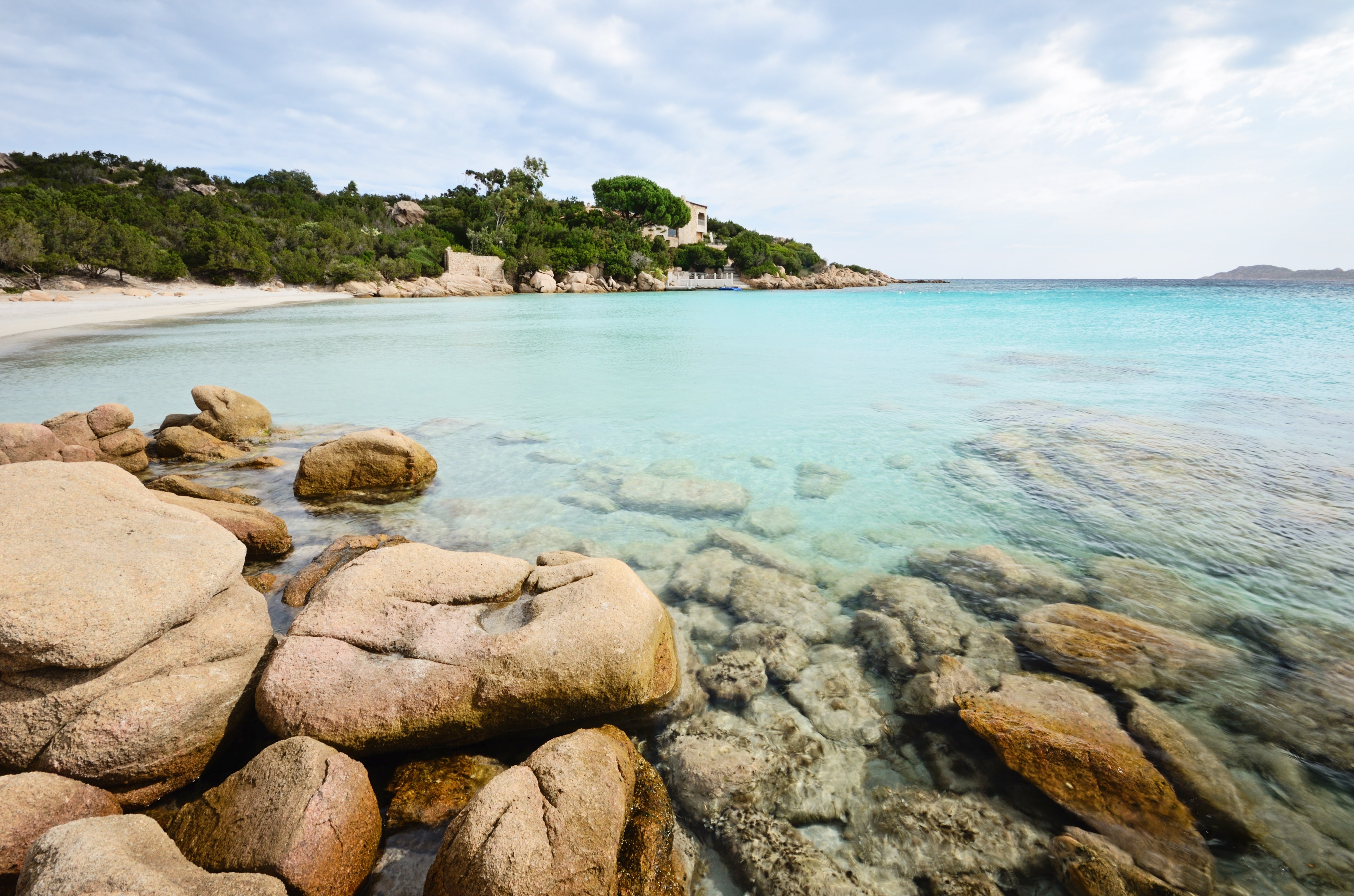 <p>This winsome beach occupies a teensy-tiny piece of Sardinia’s Costa Smeralda, one of the most beautiful—and most expensive—stretches of coastline in all of Italy; in the mid-2010s, real estate prices reached up to $40,000 per square foot. This sandy spot is famous for its Bermuda-blue water and the glamorous resort overlooking it, the <a href="https://cna.st/affiliate-link/d5Zy5wnNZ5WxtxdHZTNmyXgVyynEqsfKLx52jHGjd4gLhnVsj3F1kRYdPhLUbipiZPWS8Hn38B48LtgYr3DxZ1TBjXdCb6EHKhMbc14bcfAecdosb2AACNhX89G2AU9HFyh6f5CwjCczhZGeSpsxXBQZTfLKQACK8DHWK896P5UxwDsWbE3LMyMfAbnGeYqha1n" rel="sponsored">Cala di Volpe, a Luxury Collection Hotel, Costa Smeralda</a>, but the waters are open to the public, and you don’t need to be a guest of the hotel to swim there.</p> <p>If you can’t find a spot for your beach blanket though, there are <em>molte altre spiagge</em> in the area. Nearby Romazzino has a gorgeous bunch of them—and while you’re in the neighborhood, you can check into the newly reimagined <a href="https://www.expedia.com/Arzachena-Hotels-Romazzino.h24461.Hotel-Information">Romazzino, a Belmond Hotel, Costa Smeralda</a> is opening this summer. Get to the Costa Smeralda by flying or ferrying into Olbia, and renting a car to check out all the stunning resort towns that dot this end of Sardinia.</p><p>Sign up to receive the latest news, expert tips, and inspiration on all things travel</p><a href="https://www.cntraveler.com/newsletter/the-daily?sourceCode=msnsend">Inspire Me</a>