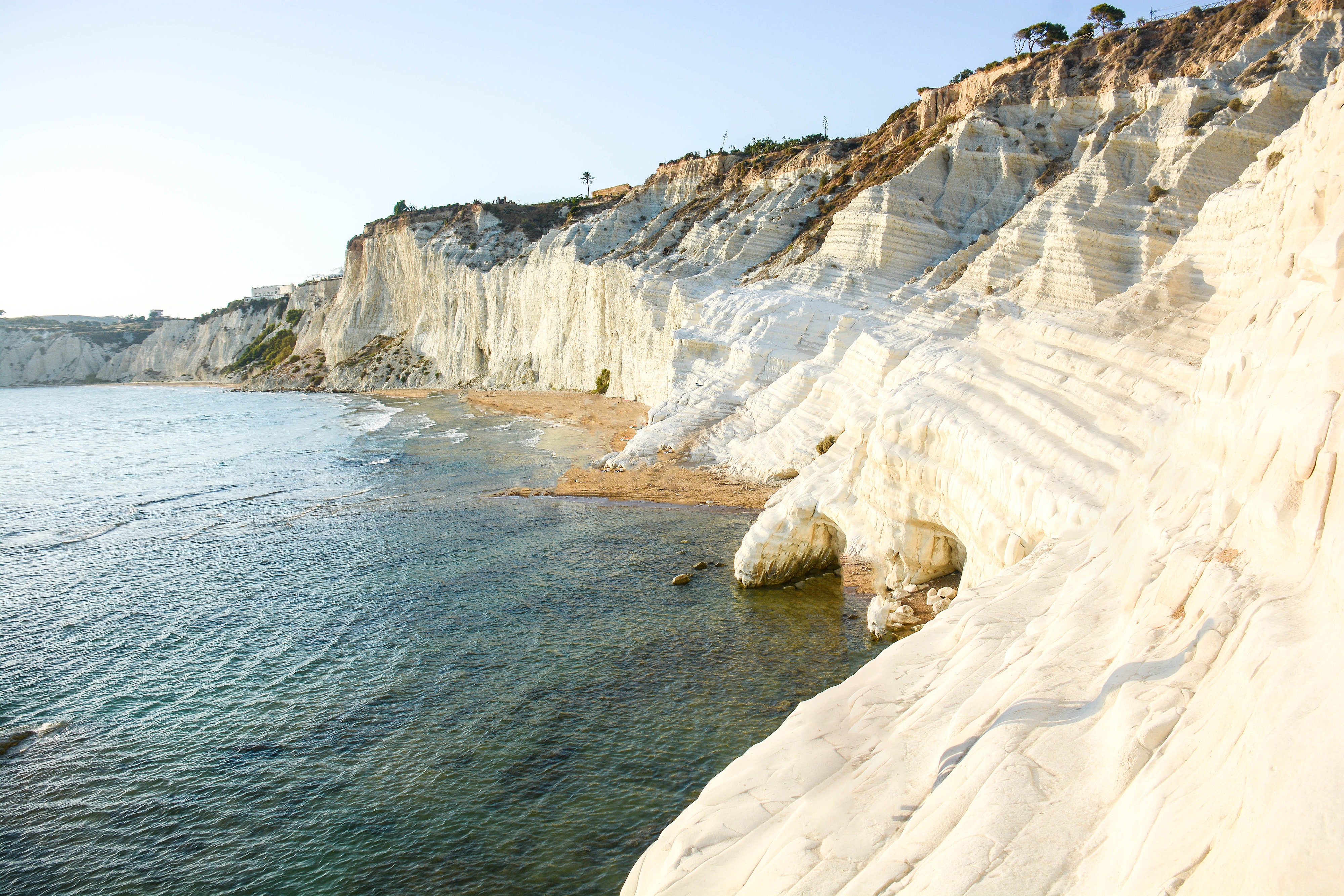 <p>The Scala dei Turchi—Italian for “Turkish Steps,” or more literally “Stairs of the Turks”—is a rocky cliff on the coast near the town of Realmonte on the southern edge of <a href="https://www.cntraveler.com/story/sicily-italy-itinerary?mbid=synd_msn_rss&utm_source=msn&utm_medium=syndication">Sicily</a>. The name dates back to the Middle Ages, when Ottoman corsairs sheltered themselves here from the fierce sea winds behind the crags made of characteristically white marlstone. At the base of the Scala sits a beach that is striking in its uniqueness, with fiery bronze sands offering a gorgeous contrast against the azure ocean and the pale cliffs.</p> <p>The area is about a two-hour drive from the city of Palermo (stay at the gorgeous <a href="https://www.cntraveler.com/hotels/palermo/villa-igiea-a-rocco-forte-hotel?mbid=synd_msn_rss&utm_source=msn&utm_medium=syndication">Villa Igiea, a Rocco Forte Hotel</a>), but it’s a worthwhile trek, given that it’s one of the island’s most beautiful natural wonders.</p><p>Sign up to receive the latest news, expert tips, and inspiration on all things travel</p><a href="https://www.cntraveler.com/newsletter/the-daily?sourceCode=msnsend">Inspire Me</a>