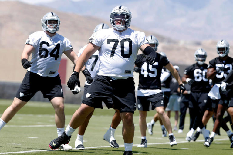 Raiders rookie guard Jackson Powers-Johnson (70) warms up during rookies first day of practice at the Intermountain Healthcare Performance Center on Friday, May 10, 2024, in Henderson. (Bizuayehu Tesfaye/Las Vegas Review-Journal) @bizutesfaye