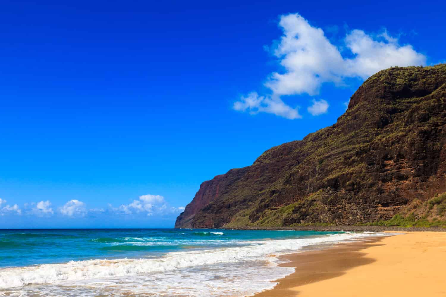 <p>On Kauai's most northern point is Nualolo Kai Beach, accessible only by hiking or boat. The area is rich in history, for example, ancient petroglyphs can be found all over the beach. The clear waters offer a view of many tropical fish, sea turtles, dolphins, and a variety of coral.</p>
