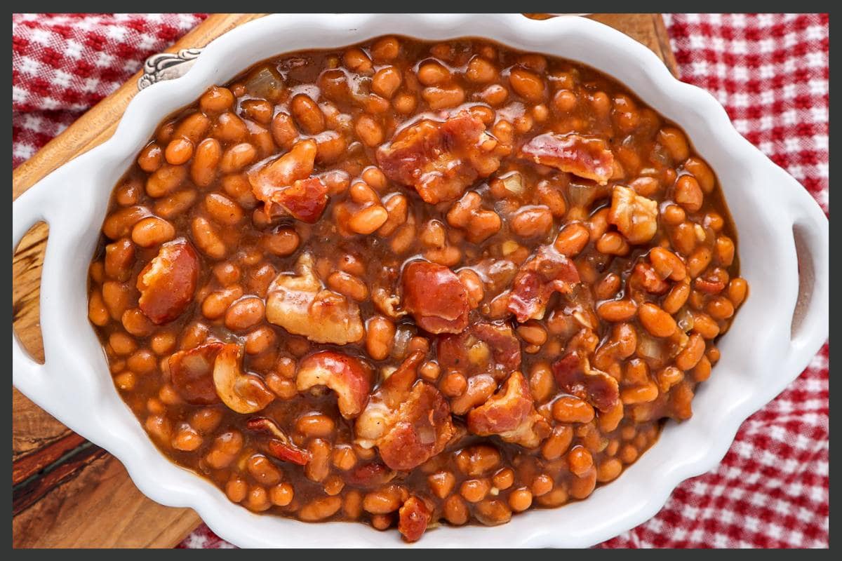 <p>The best homemade slow cooker Boston baked beans are made with molasses, brown sugar, and plenty of chunks of bacon for an unforgettable flavor and perfect texture. Easily cooked in the Crock Pot, this easy recipe takes just 15 minutes to prepare and bubbles away all afternoon. </p> <p><strong>How To</strong>: <strong><a href="https://intentionalhospitality.com/what-to-serve-with-baked-potato-bar/">Build Your Own Potato Bar For Dinner</a></strong></p>