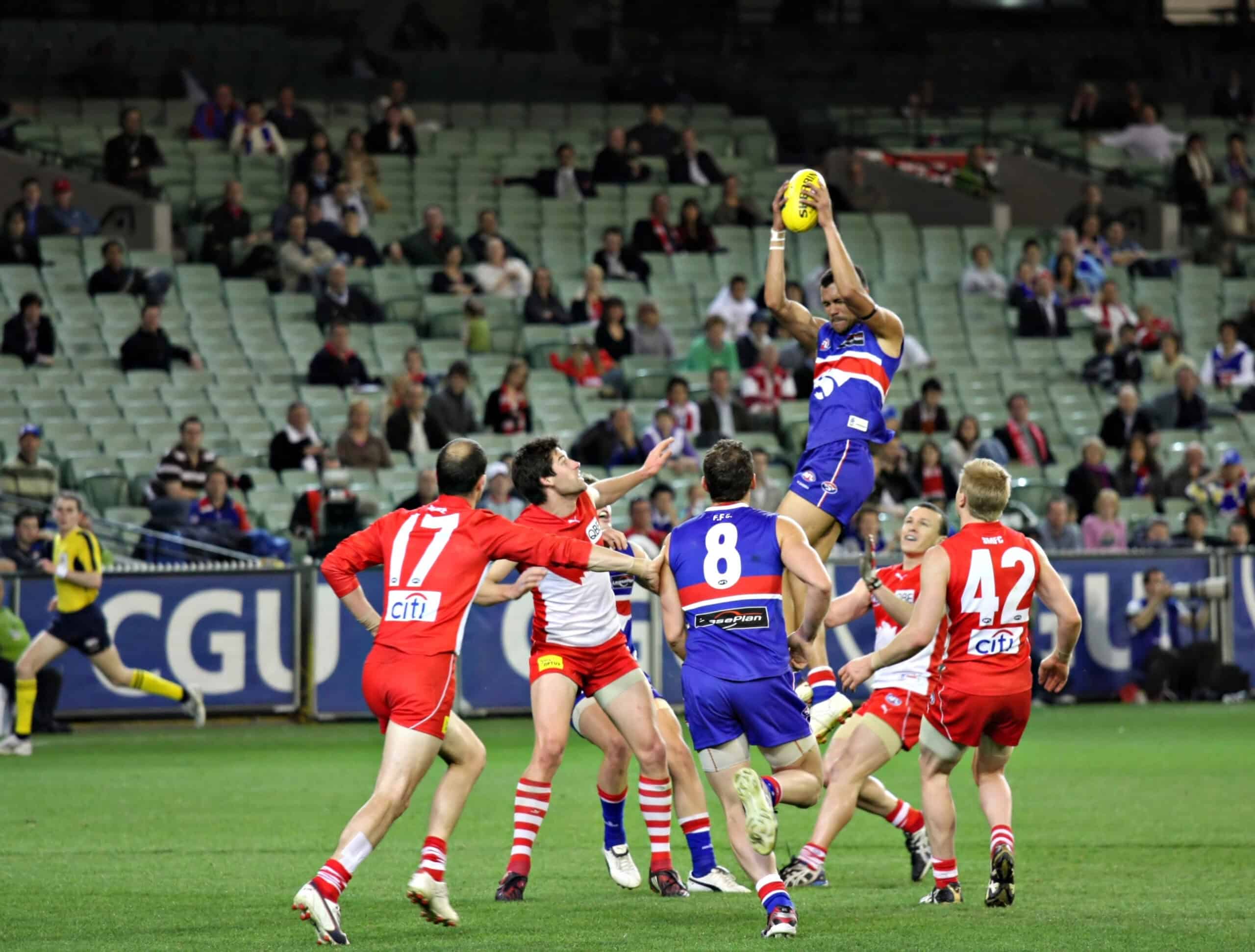 <p>Dive into the world of Australian Rules Football, and you might just find every other sporting event tame by comparison. Known colloquially as “footy,” these matches blend the excitement of soccer, rugby, and Gaelic football into a uniquely gripping spectacle that commands the attention of its audience with relentless energy and pace. </p> <p>The atmosphere at an AFL game is nothing short of electric — from the roaring crowds and heart-stopping plays to the communal spirit that sweeps through the stands. Once you’ve experienced the fervor of fans cheering under the stadium lights, other sports might just lose a bit of their luster.</p>