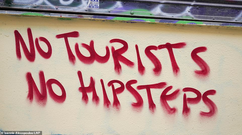 The sprawling anti-tourism drive seen across several sunny destinations in Europe has spread to Athens as the historic city demands an end to 'over-tourism' through harsh graffiti messages. Last month, furious protesters also took to the streets of the Greek capital to voice their outrage at the rising numbers of tourists flooding their home.