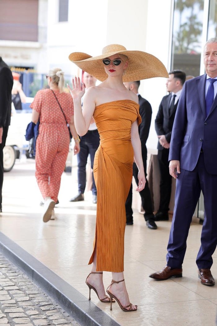 anya taylor-joy’s astronomically large sun hat is why this outfit works