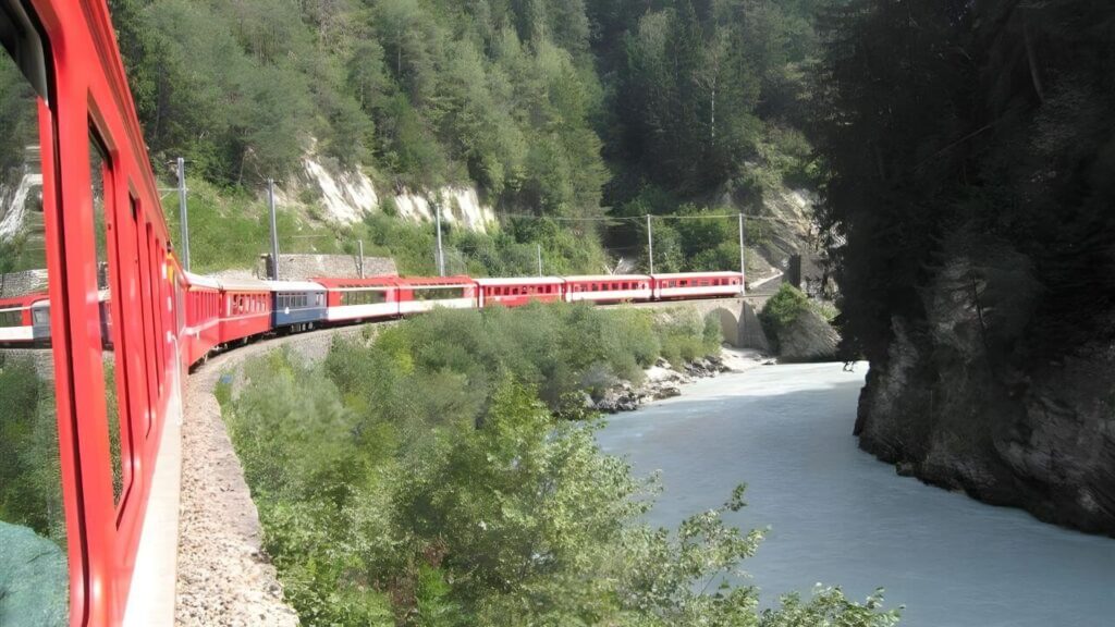 <p>The Glacier Express is the perfect rail adventure for travelers looking for Swiss railway experiences. Driven daily, it travels 105 miles (170 km) from luxurious St. Moritz to lovely Zermatt.</p><p>With a total journey time of 8 hours, the Glacier Express passes through meadows, forests, waterfalls, and mountains at an intentionally slow pace. This lets you take in those crazy-good views.</p>
