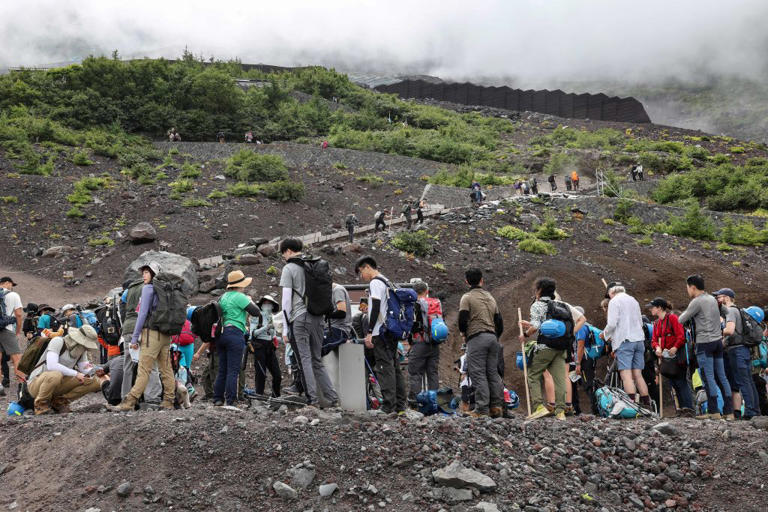Visitors climbing the slopes of Mount Fuji on Aug. 31, 2023.