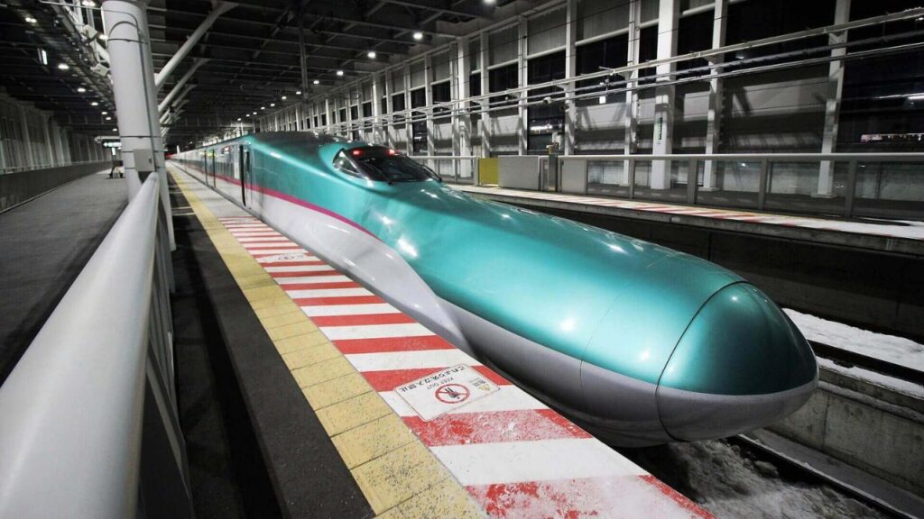 <p>Japan is a land of extremes, especially in terms of its train transportation. The Shinkansen Bullet Train is a technological mystery that gets its citizens and travelers to their destinations faster and safer than traditional trains. </p><p>The train has an incredible top speed of 200 mph (320 km/h). It passes rural Japan through mountains and along rivers and lakes. Overall, it’s a cultural experience as Japanese as it gets—with food trolleys and staff that bow as you enter and leave the train.</p>