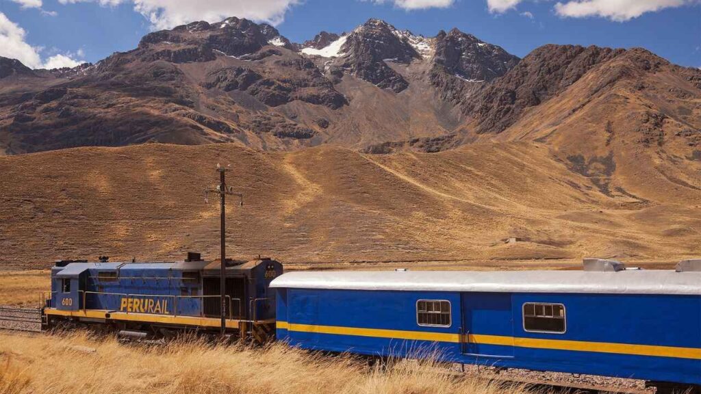 <p>Operating three times a week, the Lake Titicaca Train in Peru takes 10 hours and covers 241 miles (388 km). Your journey begins at Puno and ends in Cuzco. </p><p>You’ll cross the Altiplano, which allows you to witness breathtaking views of the Andes mountain range and the Peruvian plains. From the window of your seat, you’ll get inspired by the beauty of Peru’s landscape and cute alpacas along the way. </p>