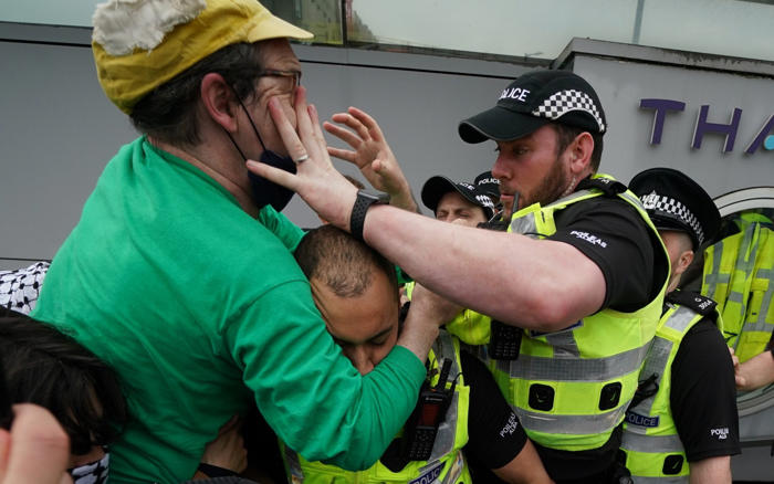 pro-palestinian protesters clash with police at glasgow arms manufacturer