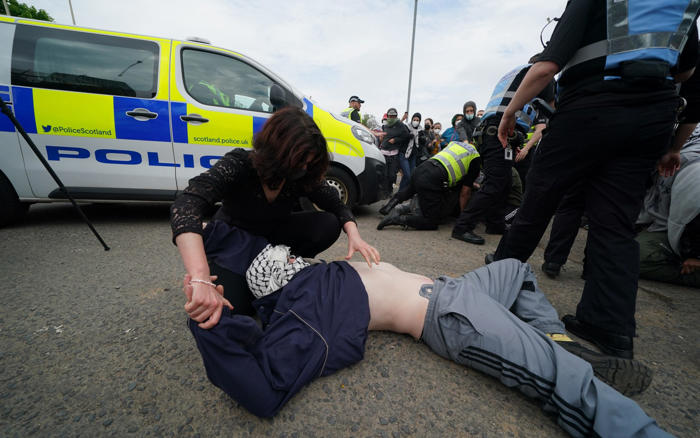 pro-palestinian protesters clash with police at glasgow arms manufacturer