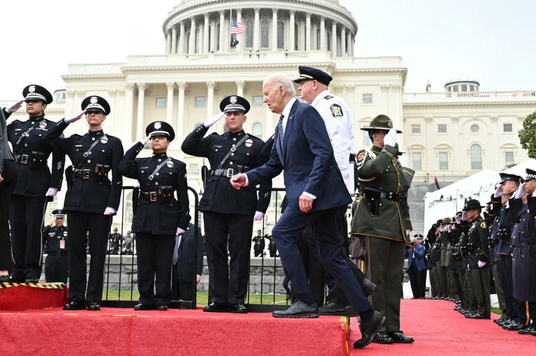 US President Joe Biden arrives to speak at the National Peace Officers' Memorial Service outside the US Capitol in Washington, DC, May 15, 2024. While attending the event on May 15, Biden appeared to trip on stage while walking up stairs.