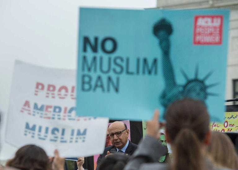 Demonstrators rally outside the Supreme Court as it hears arguments over President Donald Trump’s effort to ban immigrants from several Muslim-majority countries on April 25, 2018.