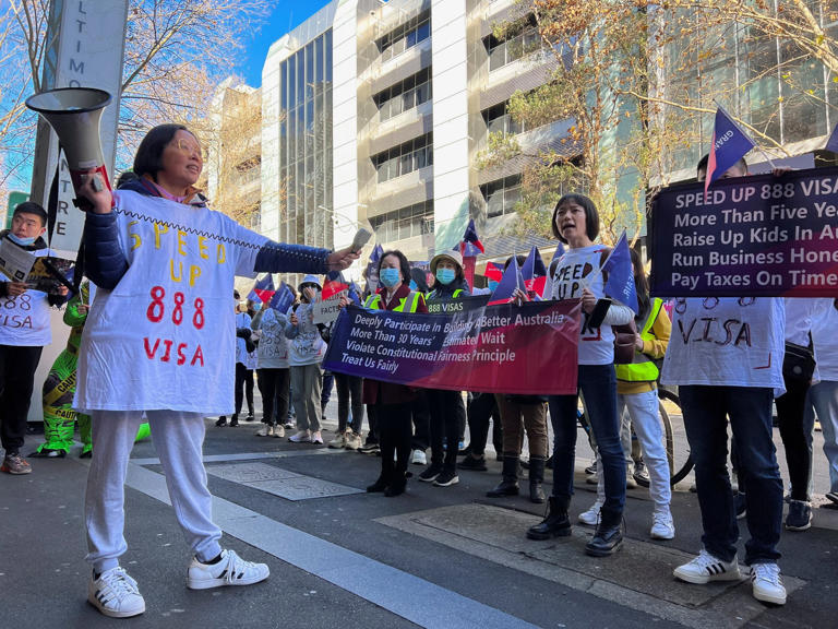 Chinese migrants protest against Australia's policy shift on the investment visa scheme, as they march outside the Australian Broadcasting Corporation office in Sydney, Australia, in June 2023. Photo: Reuters
