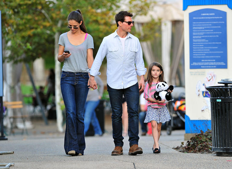 Katie Holmes, Tom Cruise and Suri Cruise visit Schenley Plaza's carousel on October 8, 2011 in Pittsburgh, Pennsylvania. Suri recently adopted a new name on her musical's Playbill.