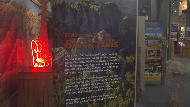 A "Welcome to the Black Hills" sign is shown.