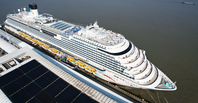 Adora Magic City, the first made-in-China large cruise ship, waits for its first commercial passengers on the dockyard in Shanghai on January 1, 2024. 