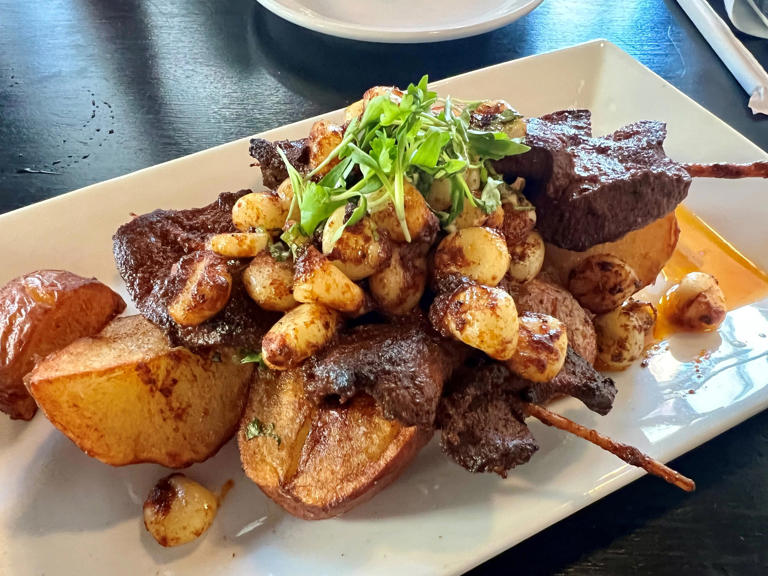 The anticuchos starter -- veal heart, Peruvian corn and crispy potatoes -- at Limo Peruvian Eatery in East Nashville on May 9, 2024
