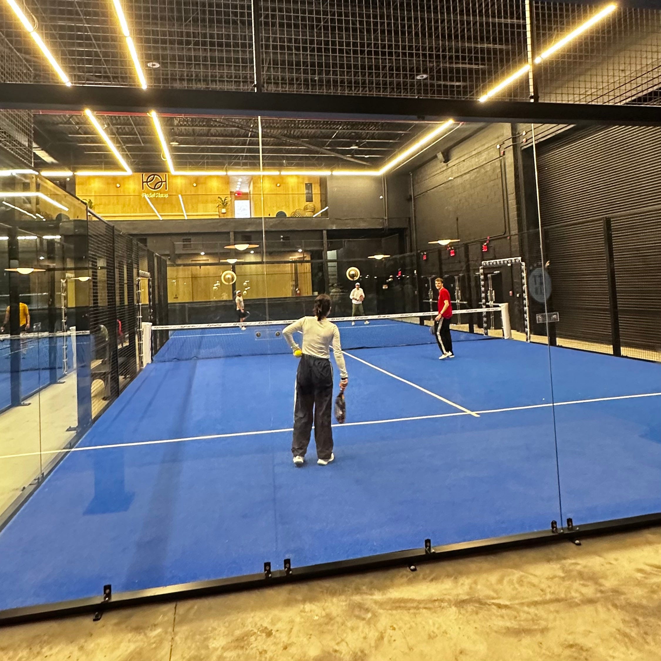 <p>It's played in doubles with rackets that look like a cross between a pickleball paddle and a squash racket.</p><p>The sport originated in Mexico when a businessman named Enrique Corcuera built the first padel court at his home in Acapulco. It eventually made its way to Spain — gaining popularity among affluent Europeans, BoF reported. It's now gaining a foothold in the US; Padel Haus, for example, is expanding from its NYC locations to Nashville and Denver.</p>