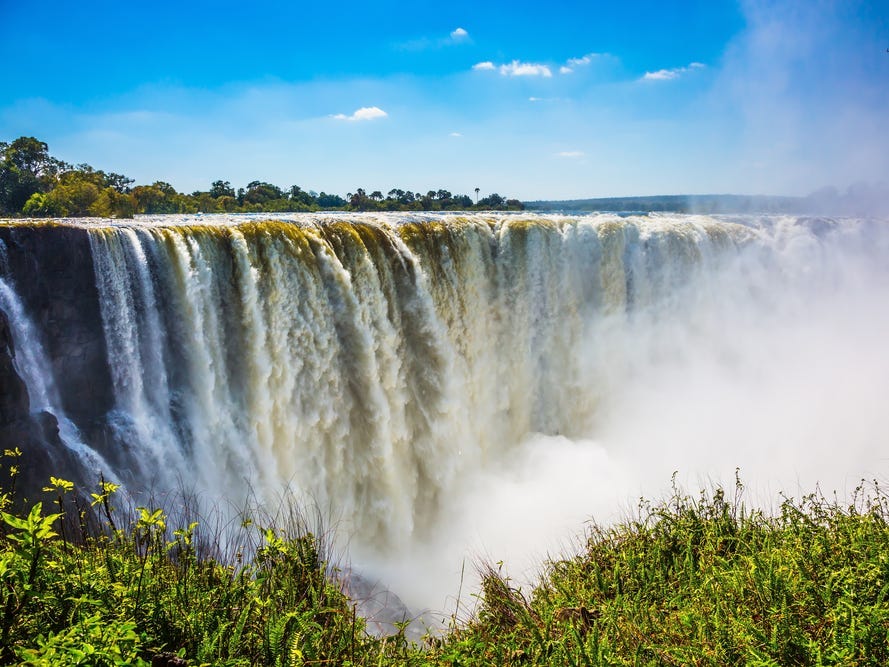 <p>Zimbabwe is home to some extraordinary natural beauty. One of the most popular attractions is Victoria Falls, the world's largest curtain of falling water. Locals call it <a href="https://whc.unesco.org/en/list/509/">Mosi-oa-Tunya</a>, which means "the smoke that thunders."</p><p>We ended our day at the falls with drinks at the Victoria Falls Safari Lodge, which overlooks a waterhole. As we enjoyed our cocktails, we watched the African wildlife come in for a drink.</p><p>Later, we headed to <a href="https://theboma.co.zw/">The Boma</a> for dinner and a drum show. The buffet featured every type of game meat imaginable.</p>