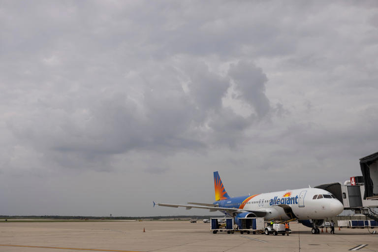 A plane lands and connects to the loading bridge, waiting to board passengers for its first direct flight to the Nashville International Airport on Thursday, May 16, 2024, at the Chicago Rockford International Airport.